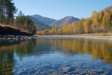 Naklejka premium A picturesque riverside landscape displaying vibrant autumn foliage and stunning mountain reflections, all nestled beside a calm and tranquil river