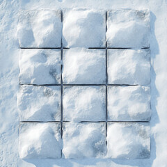 Fototapeta premium Square tiles laying in clean snow, shot directly from top