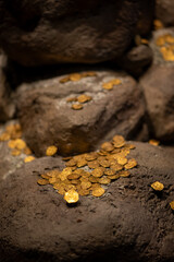 Ancient gold coins from the colonial era scattered over large rocks, resembling a lost treasure. The gleaming gold contrasts with the rugged stone, evoking history, wealth, and adventure.