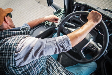 Truck Driver Navigating Through a Busy Urban Route During Daytime