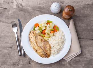 Grilled tilapia or saint peter with rice and vegetables