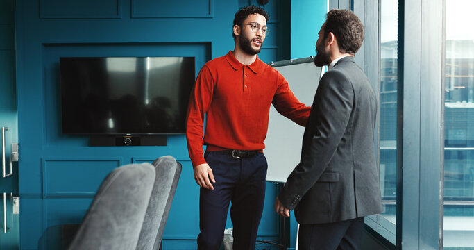 B2B, conversation and merger with business people in corporate office for discussion or negotiation. Meeting, planning or takeover with manager and client speaking in workplace for partnership