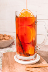 Winter warming tea with raspberry juice, cloves, cinnamon and oranges.