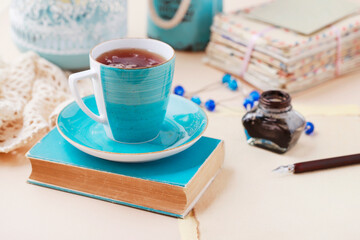 A blue cup on the table.