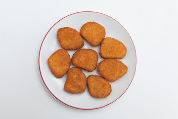 GeneraFried chicken wings on a plate on a white background  close-upted image