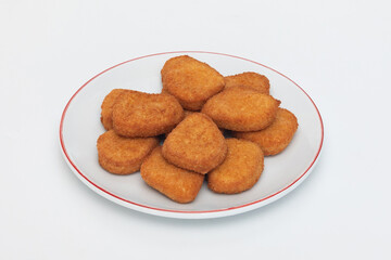 GeneraFried chicken wings on a plate on a white background  close-upted image