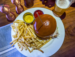 Burger with french fries and beer. Special Hamburger.