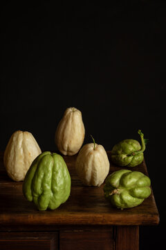 Rustic display of chayote on wooden table