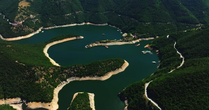 Slow River Stream Meandre Through Mountain Range Vibrant Aerial Cinematic Opening Shot