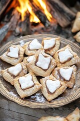 Abergavenny Food Festival Rustic apple pastries with heart design in cozy firelit setting