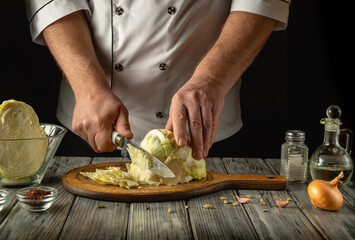 A skilled cook prepares fresh cabbage in a cozy kitchen. The atmosphere is warm with wooden surfaces and a variety of ingredients laid out, creating a perfect setting for culinary creativity