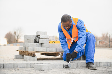 Pavement. Laying paving stones. Cube, openwork plate