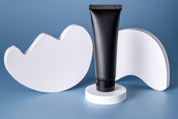Modern cosmetic tube on stylized podium in studio setting