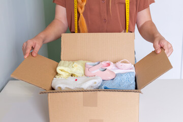 Organizing Clothes for Charity Sale, Packing Baby Items