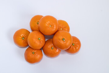 Fresh ripe tangerines with leaves on white background