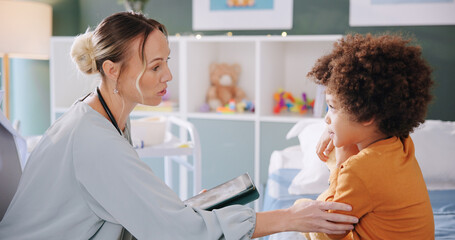 Doctor, child and tablet for check up, test results and hospital support for cardiology examination or health consultation. Pediatrician, medical expert and boy with teddy bear for comfort and scared