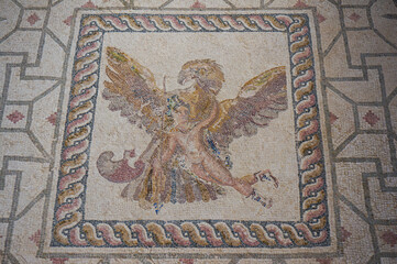 Mosaic art. Zeus and Ganymede. Olympian god turned into an eagle in order to abduct Ganymede and took him on Mount Olympus. “House of Dionysos”, Archaeological Park. Paphos, Cyprus.