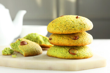 Delicious mint chocolate chip cookies on white table, closeup