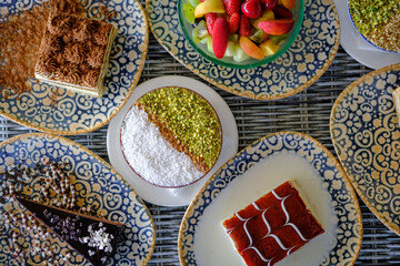 Assortment of delectable desserts on ornate plates a sweet feast for the eyes