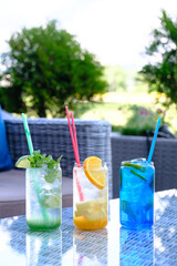 Refreshing summer drinks in vibrant colors perfect for a sunny day