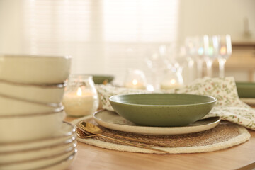 Stylish table setting with dishware and cutlery indoors