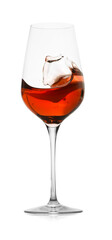 Rose wine splashing in glass on white background
