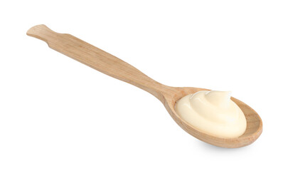 Tasty mayonnaise sauce in wooden spoon isolated on white
