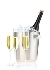 Champagne in glasses and ice bucket with bottle isolated on white