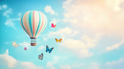 Fototapeta premium Colorful hot air balloon floats in a bright sky surrounded by vibrant butterflies during a sunny day with copy space