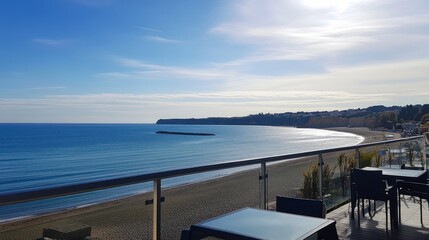 Obraz premium Coastal View from a Balcony Overlooking Sandy Beach and Ocean
