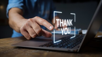 Expressing Gratitude Digitally: A Man Uses a Laptop to Send a Thank You Message