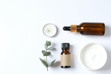 Skin care with cosmetic essential oil in a glass bottle and moisturizing cream. Dry skin care products