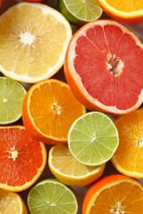 Obraz premium Various citrus fruits as a background, top view.