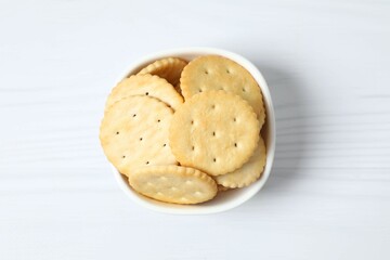 Delicious crispy crackers cookies in a plate on white background 