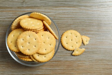 Delicious crispy crackers cookies in a plate on wooden background 