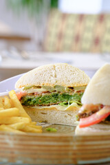 A delicious veggie burger cut in half served with a side of golden fries Fresh and flavorful!