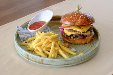 A delicious double cheeseburger served with a generous portion of golden french fries and a side of ketchup