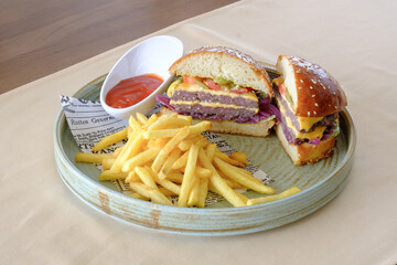 Juicy double burger golden fries and tangy ketchup – a classic satisfying meal