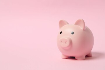 Piggy coin bank on colored background for money savings, financial security or personal funds concept.