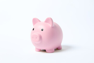 Piggy coin bank on white background for money savings, financial security or personal funds concept.