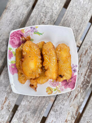 Banana fritters on a plate in a restaurant.