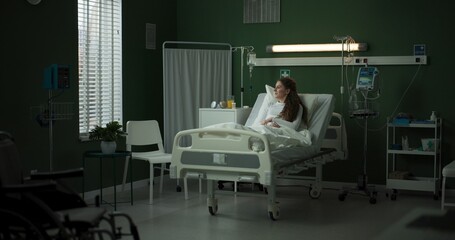 Doctor with a tablet visits the patient to discuss her treatment plan.
