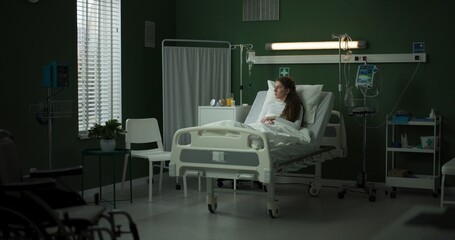 Doctor enters the room with a tablet, ready to review the patient's progress.