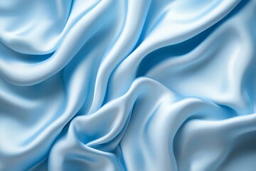 Fototapeta premium Soft, flowing light blue silk fabric with elegant drapery and folds.
