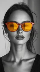Stylish portrait of a woman wearing vibrant sunglasses © BrandwayArt