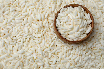 Bowl with puffed rice as background, closeup