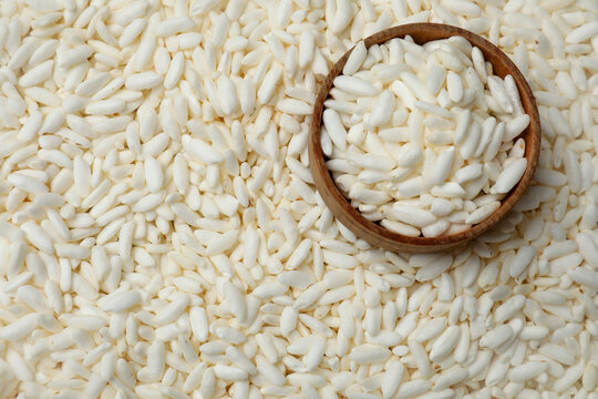 Bowl with puffed rice as background, closeup