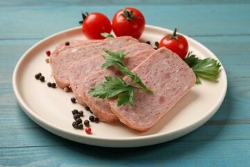 Pieces of tasty canned meat, parsley, peppercorns and tomatoes on light blue wooden table, closeup
