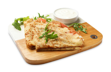 Delicious crepes with salmon, cream cheese and arugula isolated on white