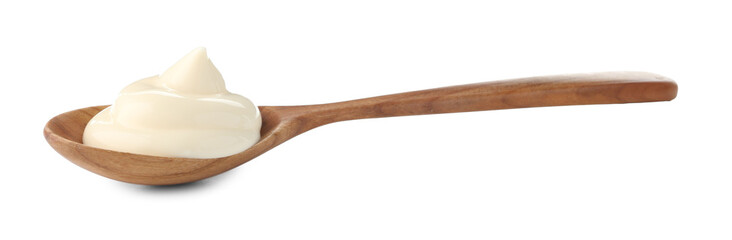 Tasty mayonnaise sauce in wooden spoon isolated on white
